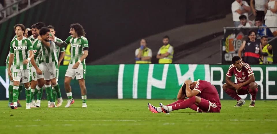 Players celebrating a goal while opponents react in despair
