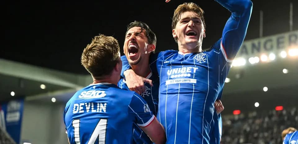 Rangers players celebrating a goal in the stadium
