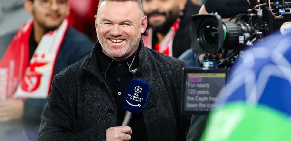 Presenter smiling with microphone before match