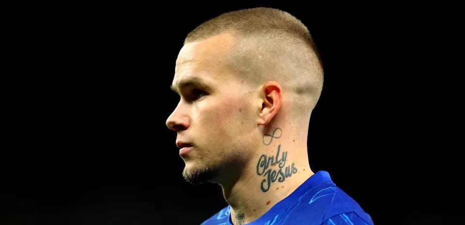 Player in blue jersey with neck tattoos