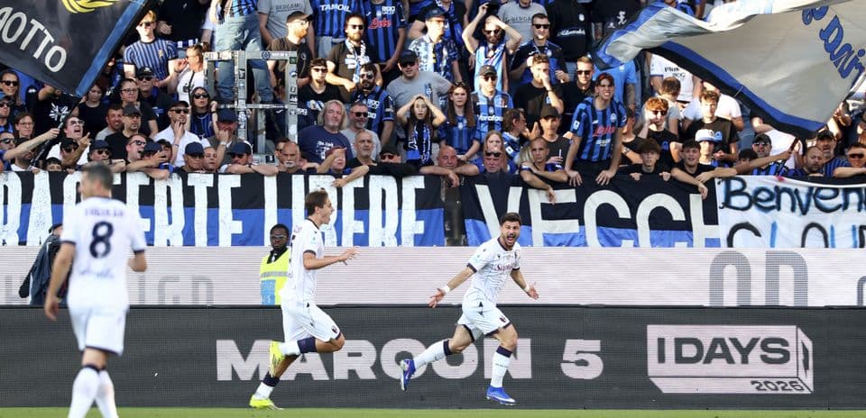 Bologna players celebrating a goal against Atalanta