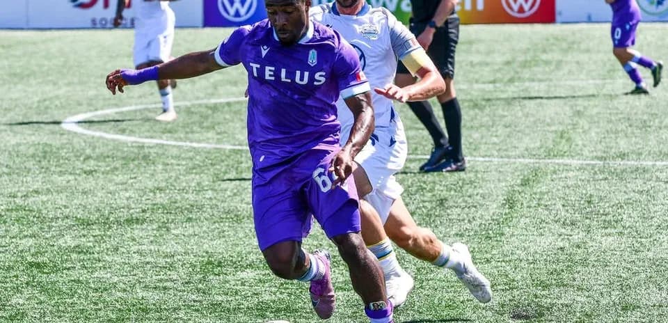 Player dribbling during Pacific FC match
