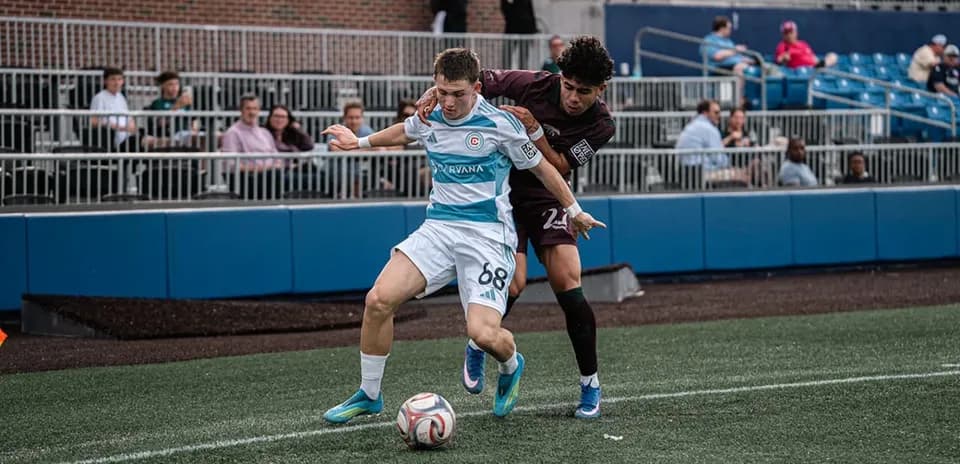 Player competing for ball during Carolina Core match