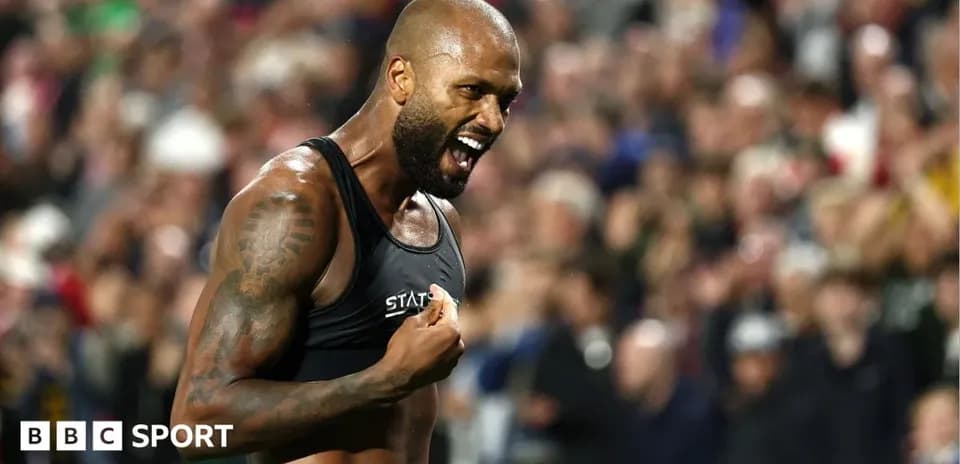 Athlete celebrating with crowd in background