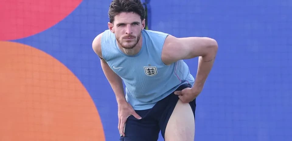 Player stretching leg during training session