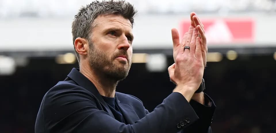 Coach applauding the crowd at the stadium
