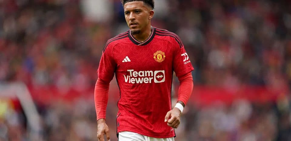 Player in red Manchester United kit on the field