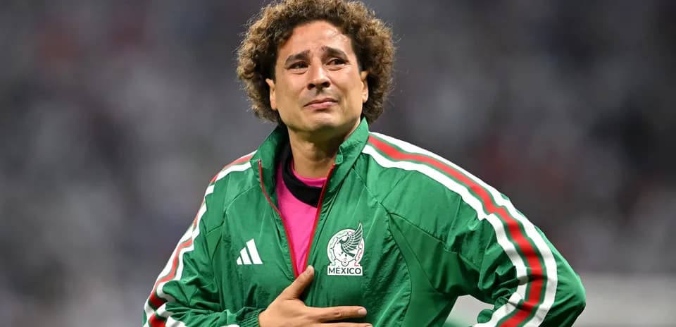 Goalkeeper in green jacket during match