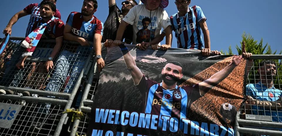 Fans holding banner welcoming player Mohammed Salah