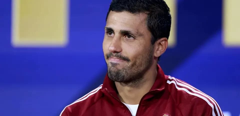 Player in Spain tracksuit at press conference