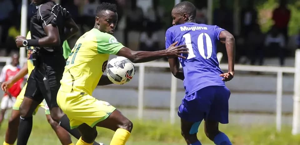 Tusker player challenging APS Bomet player for ball