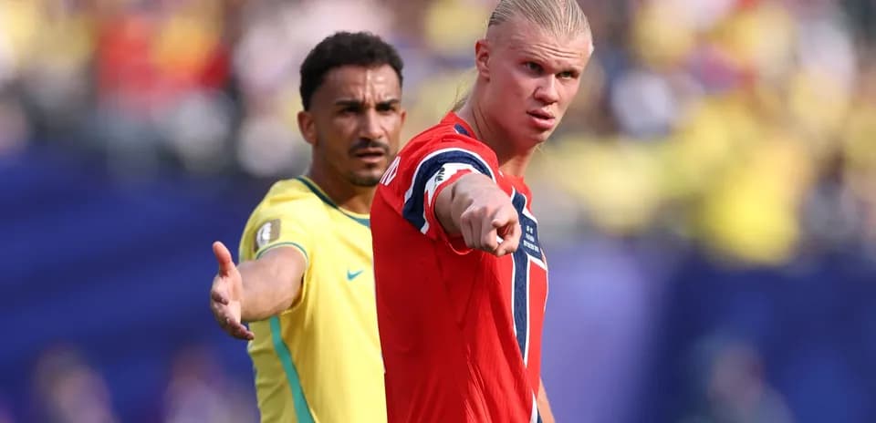 Two players in action during international football match