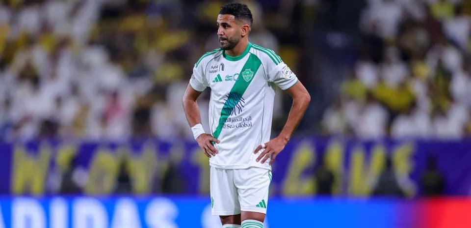 Player in green and white kit on the field