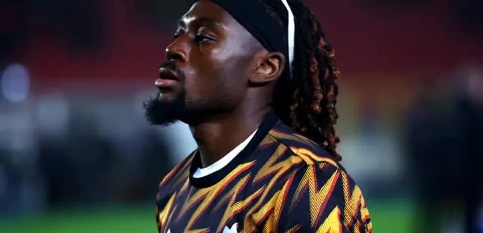 Player in colorful jersey during match warm-up