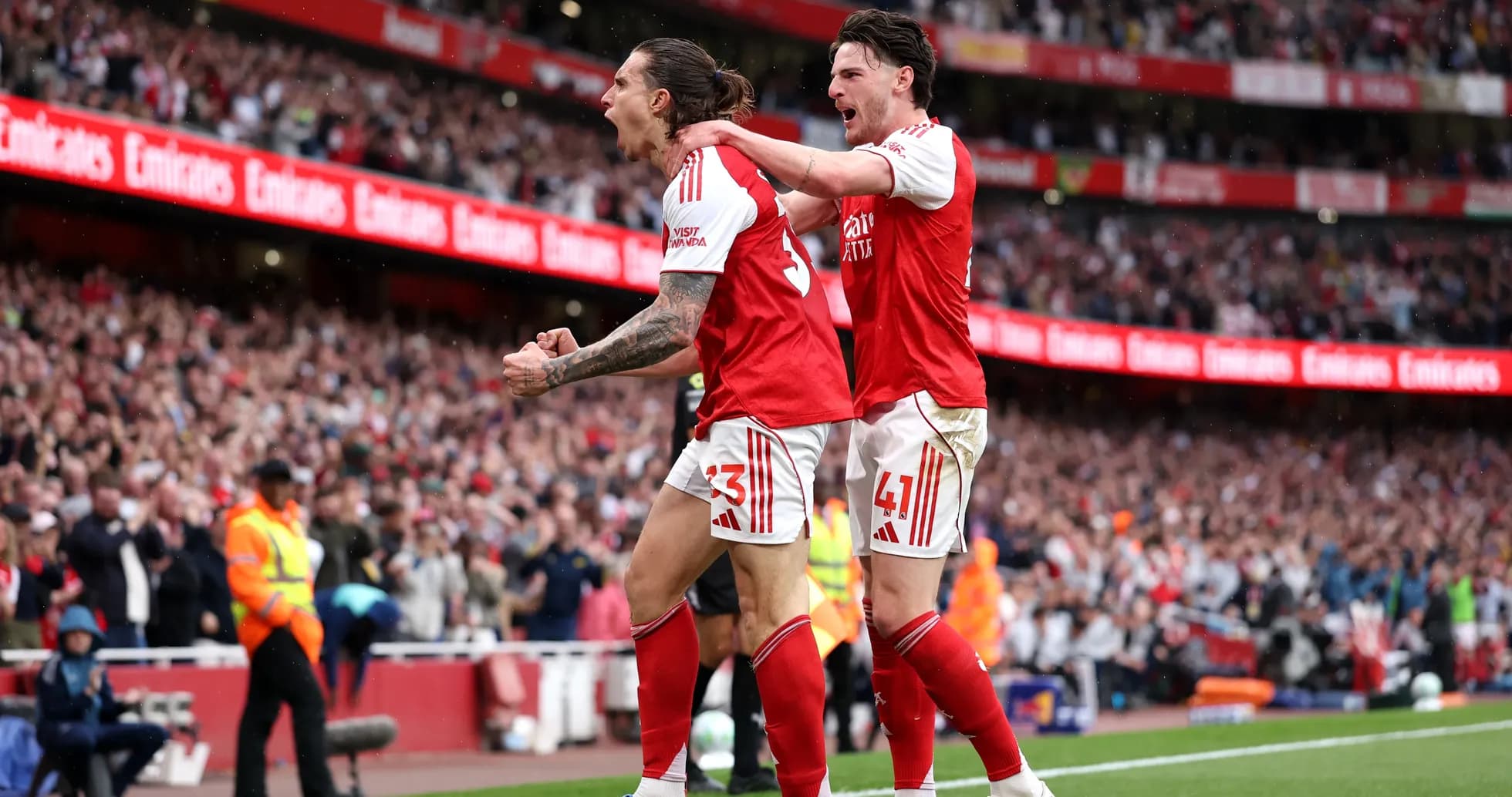 Arsenal players celebrating a goal on the pitch