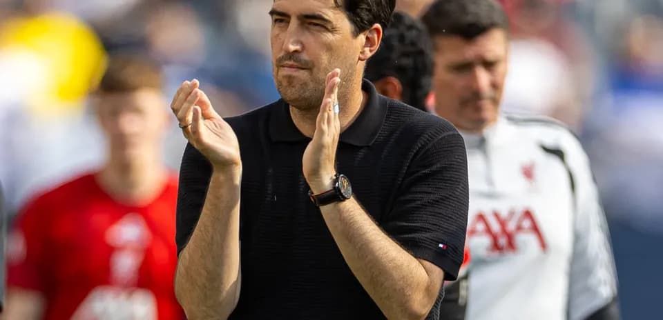 Coach applauding during a match or training session