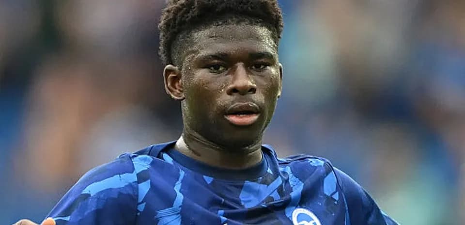 Player in blue kit during football match