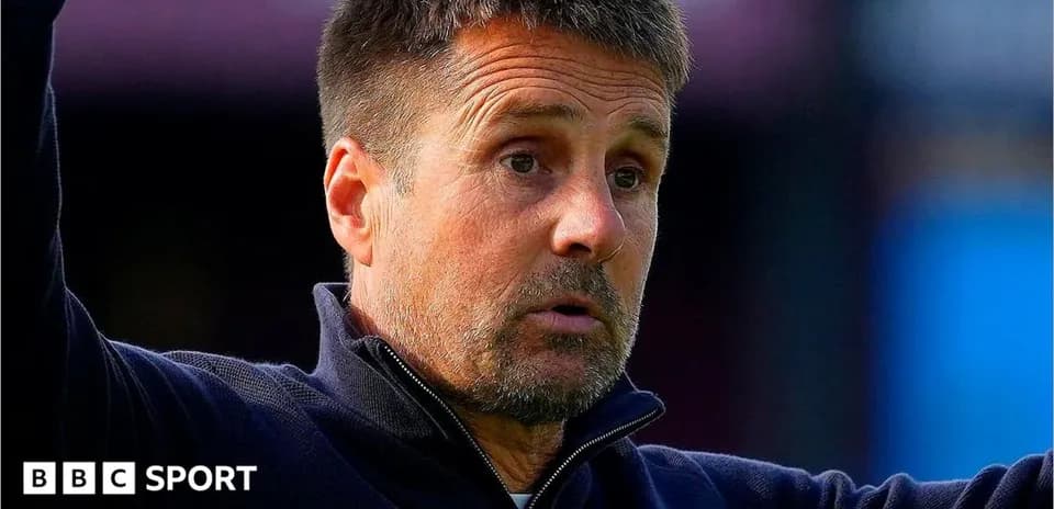 Coach gesturing during a football match