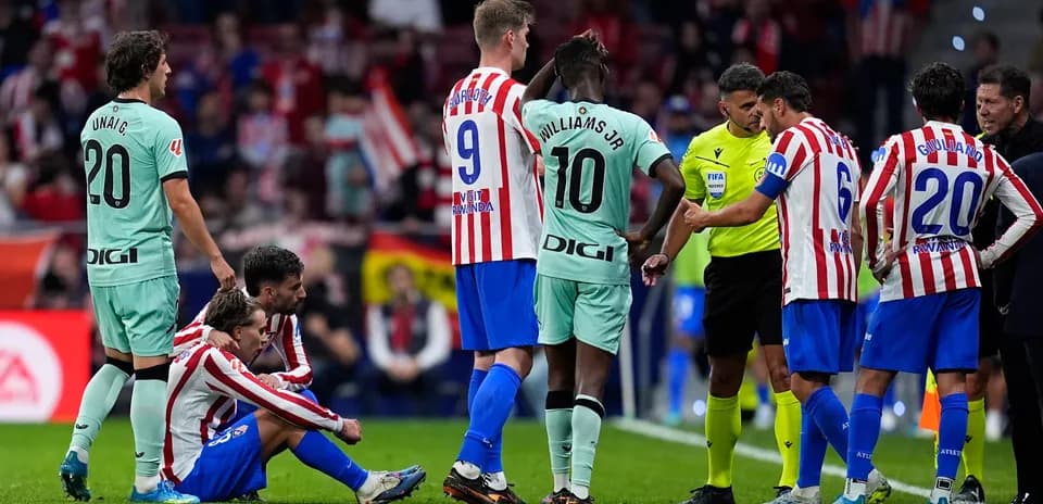 Players discussing with referee during La Liga match