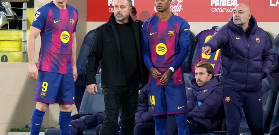 Barcelona players and coaching staff on the bench