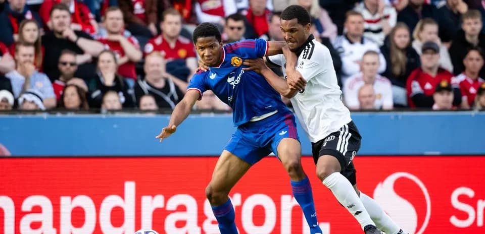 Two players competing for the ball during match