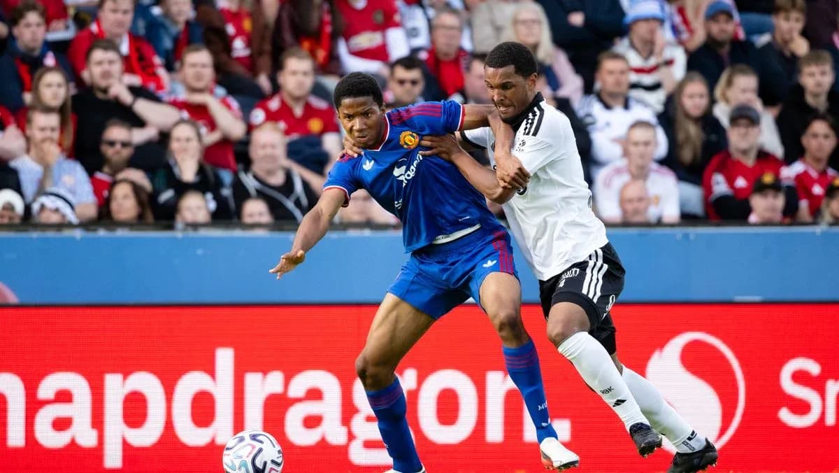 Two players competing for the ball during match