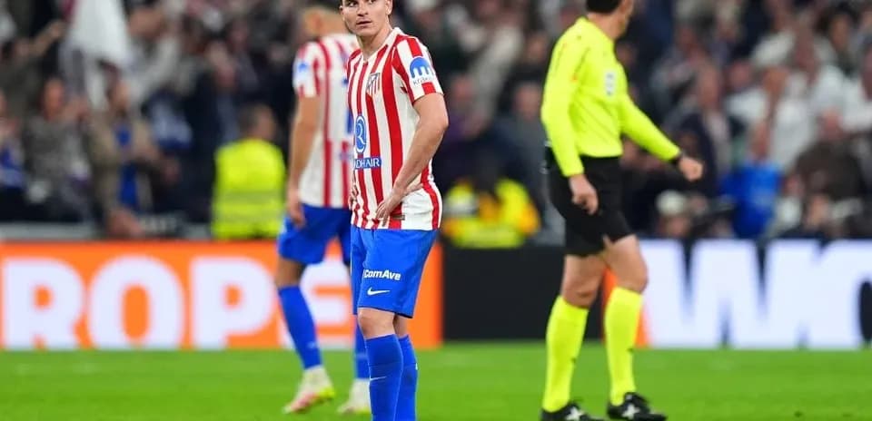 Atletico Madrid player looking disappointed on field