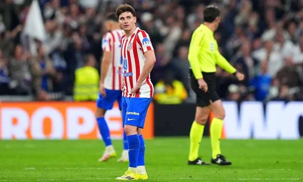 Atletico Madrid player looking disappointed on field
