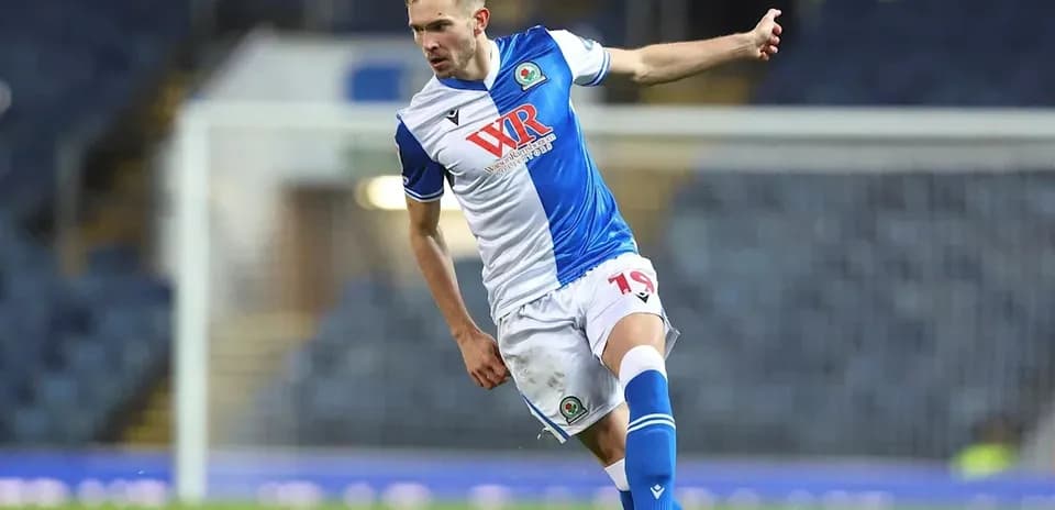 Player kicking the ball during a match