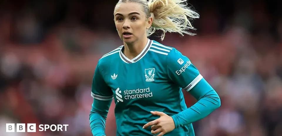 Player running in Liverpool FC kit during match