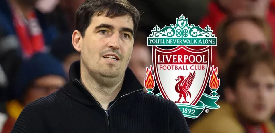 Man observing Liverpool FC logo in background