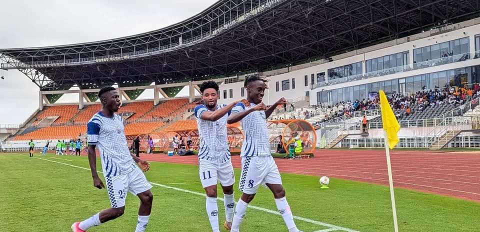 Players celebrating after a goal during match