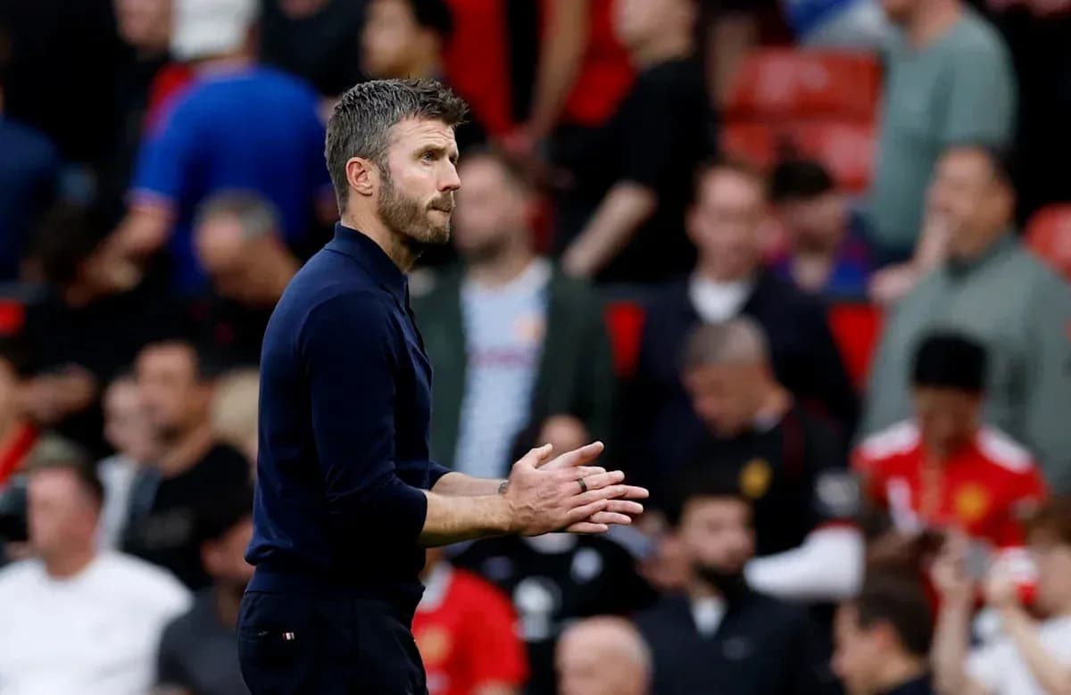 Manager clapping during a match at Old Trafford