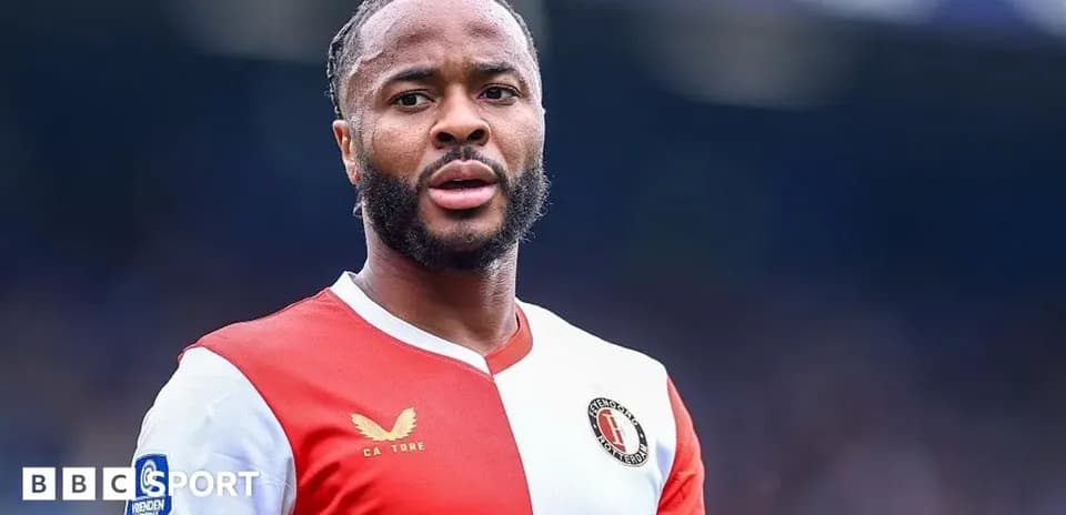Football player in red and white jersey on pitch