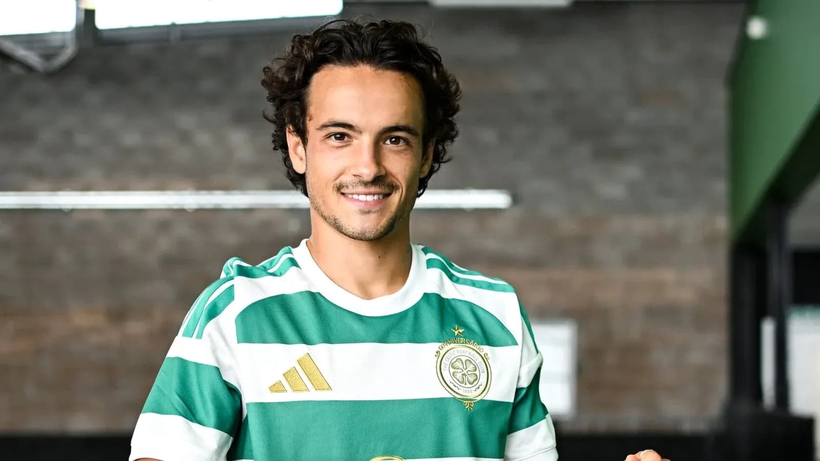 Player in Celtic FC kit smiling at camera Player in Celtic FC kit smiling at camera