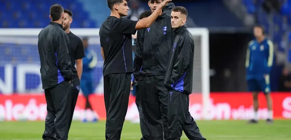 Players discussing on the field during warm-up