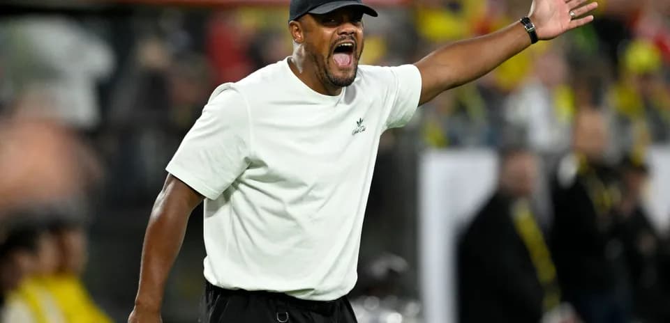 Coach gesturing during a match on the sidelines