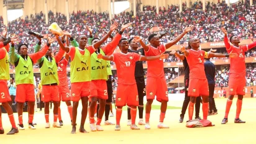 Players celebrating with fans after the match