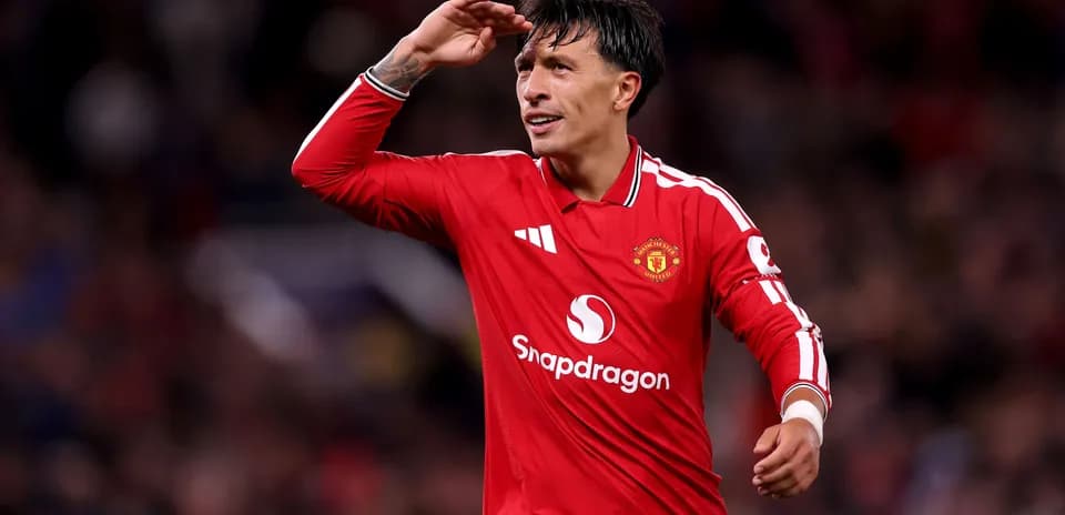 Player saluting fans during Manchester United match