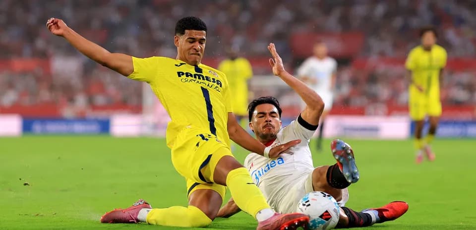 Two players contesting the ball during match