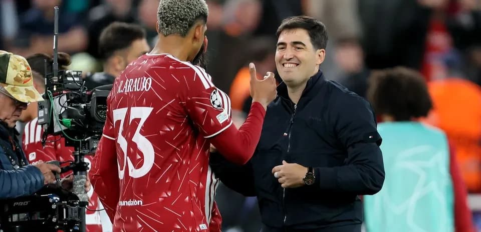Player discussing with coach during match substitution