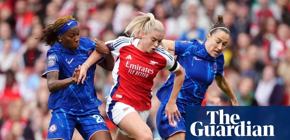 Two players tackling Arsenal player during match