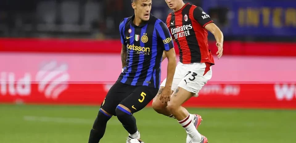 Two players competing for the ball during match