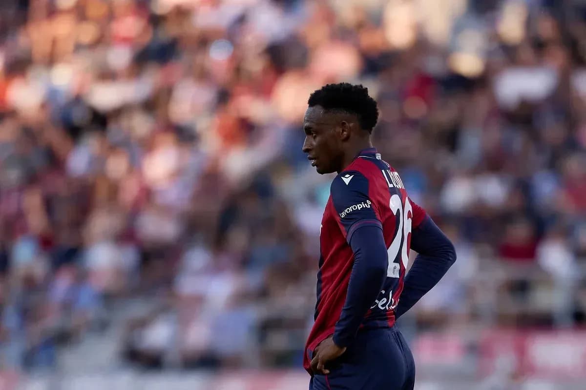 Player in red and blue kit during match