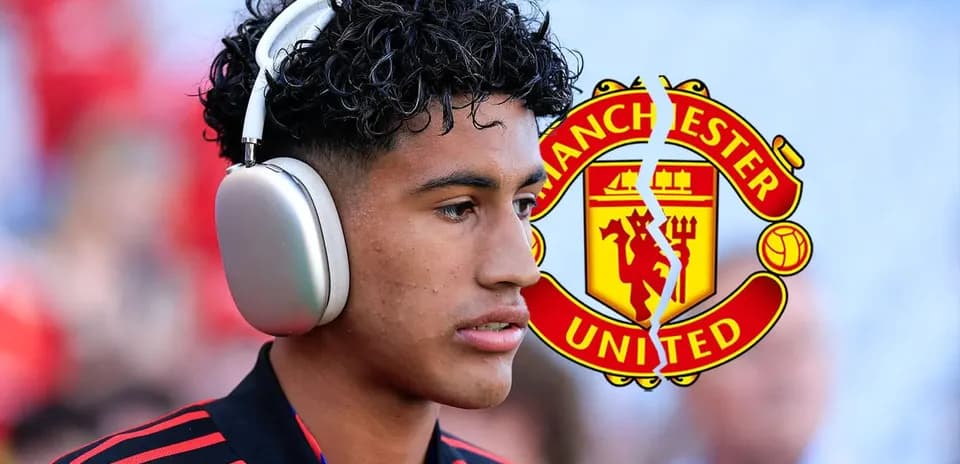 Player wearing headphones with Manchester United logo