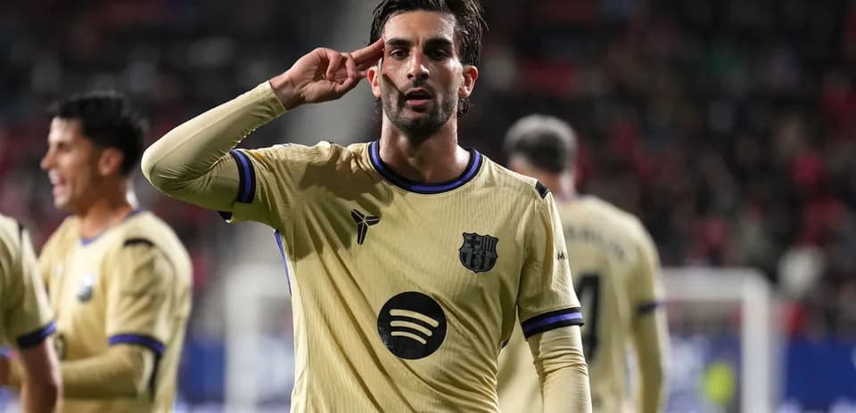 Player celebrating with salute gesture after scoring