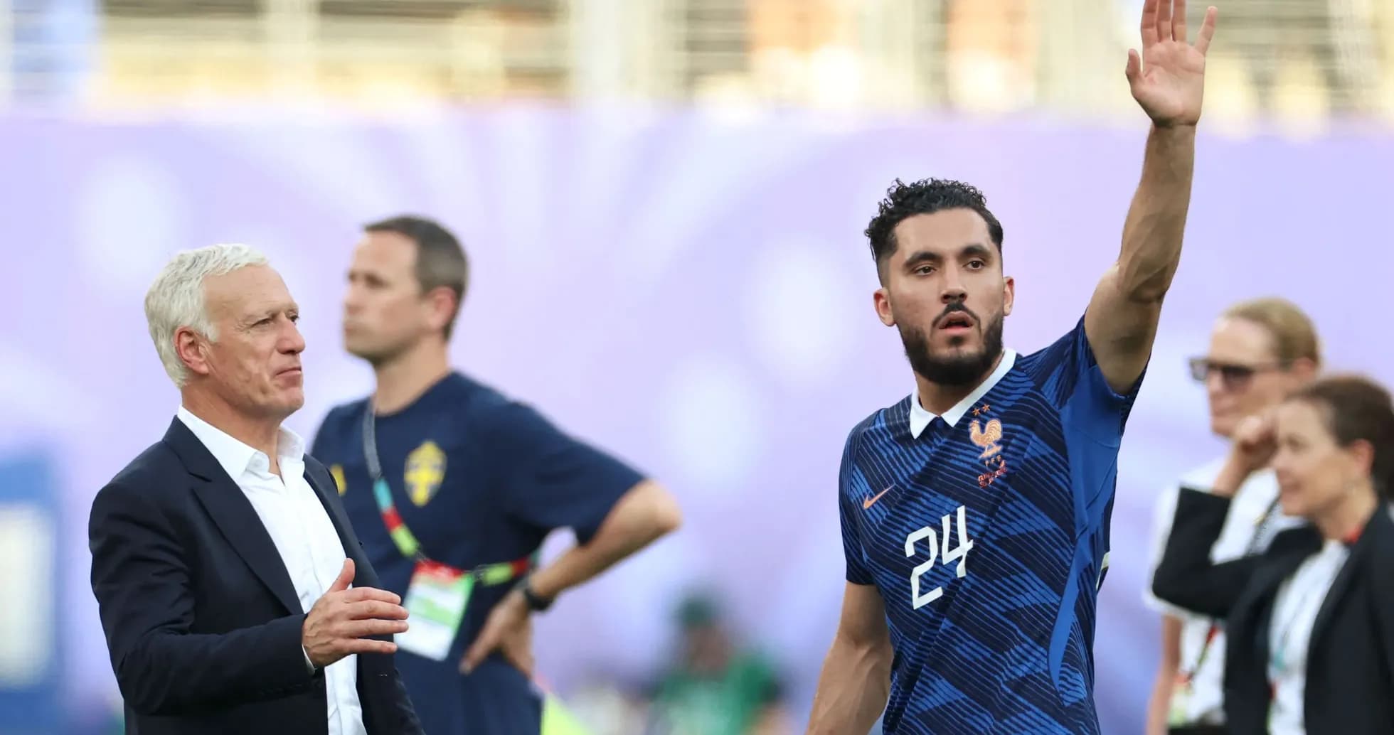 France coach and player waving during match