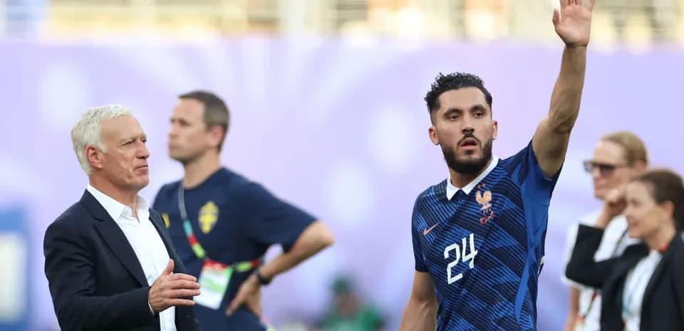 France coach and player waving during match