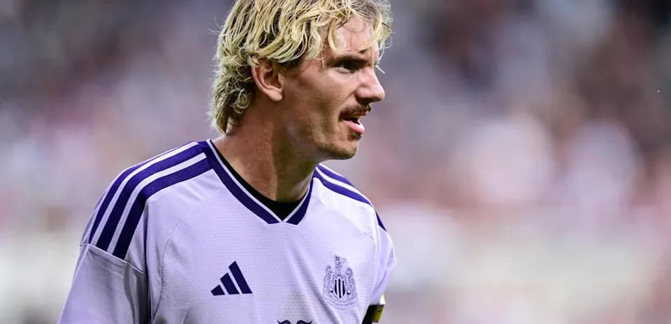 Player wearing Newcastle United jersey on the field