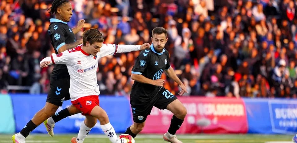 HFX Wanderers FC player dribbling past opponents